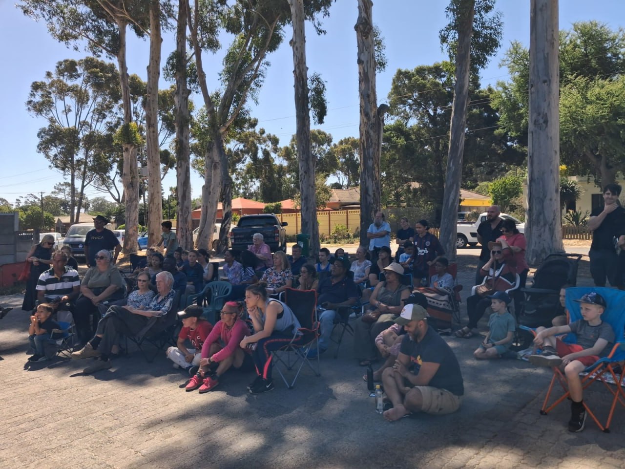 Crowd watching the Penhill Snake Show under the trees