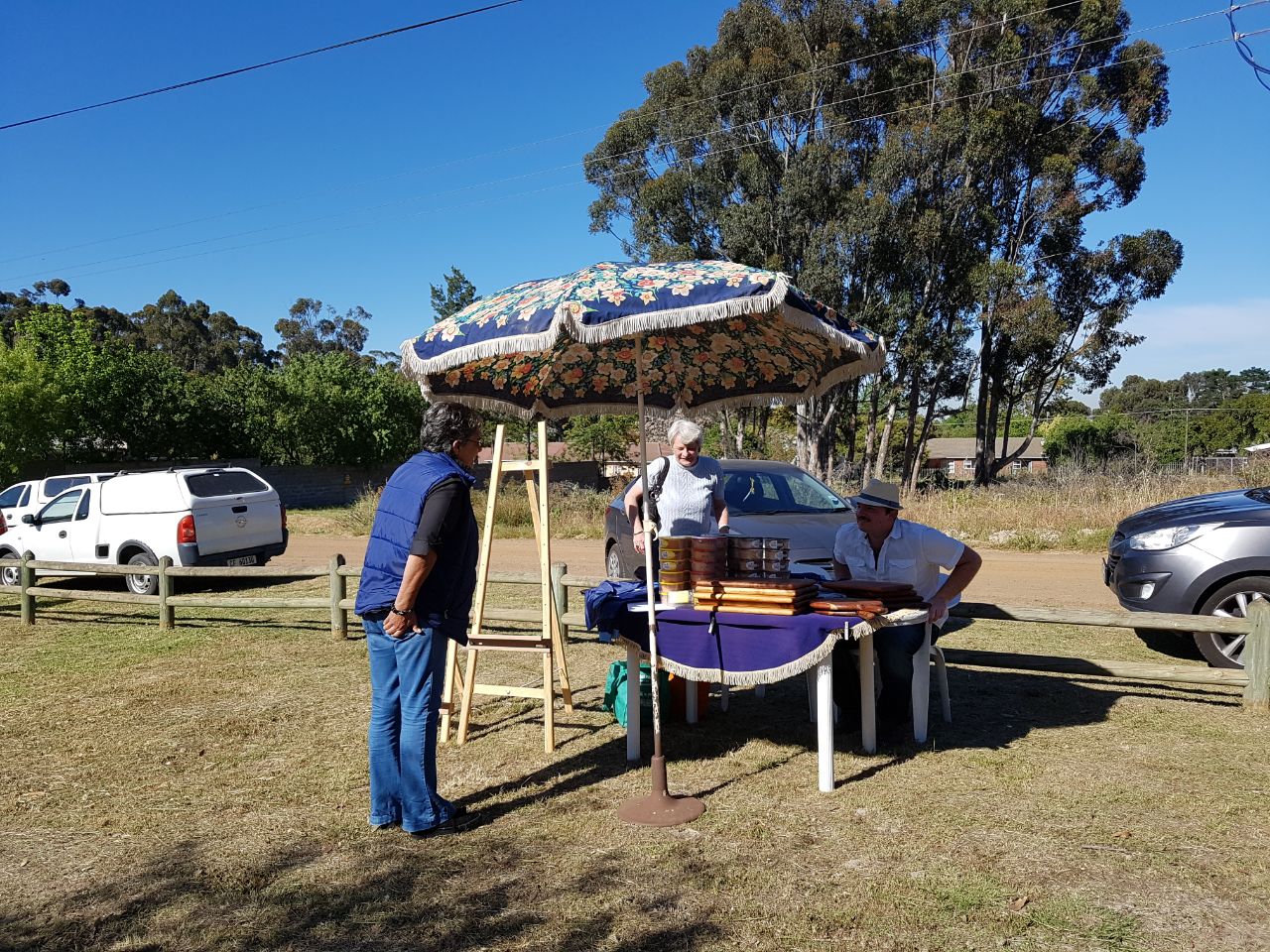 Wooden platters and boards for sale at a Penhill Market Initiative stall