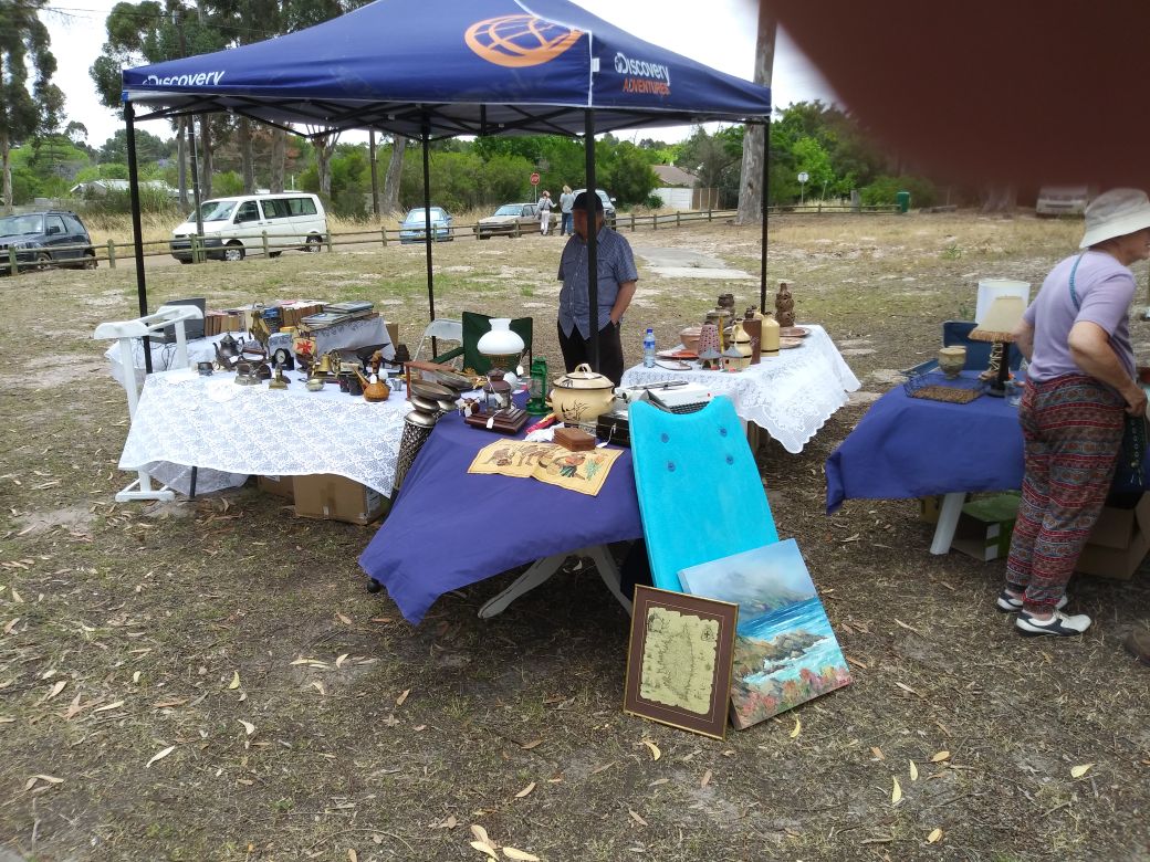Stallholders and browsers at a Penhill Market Initiative stall